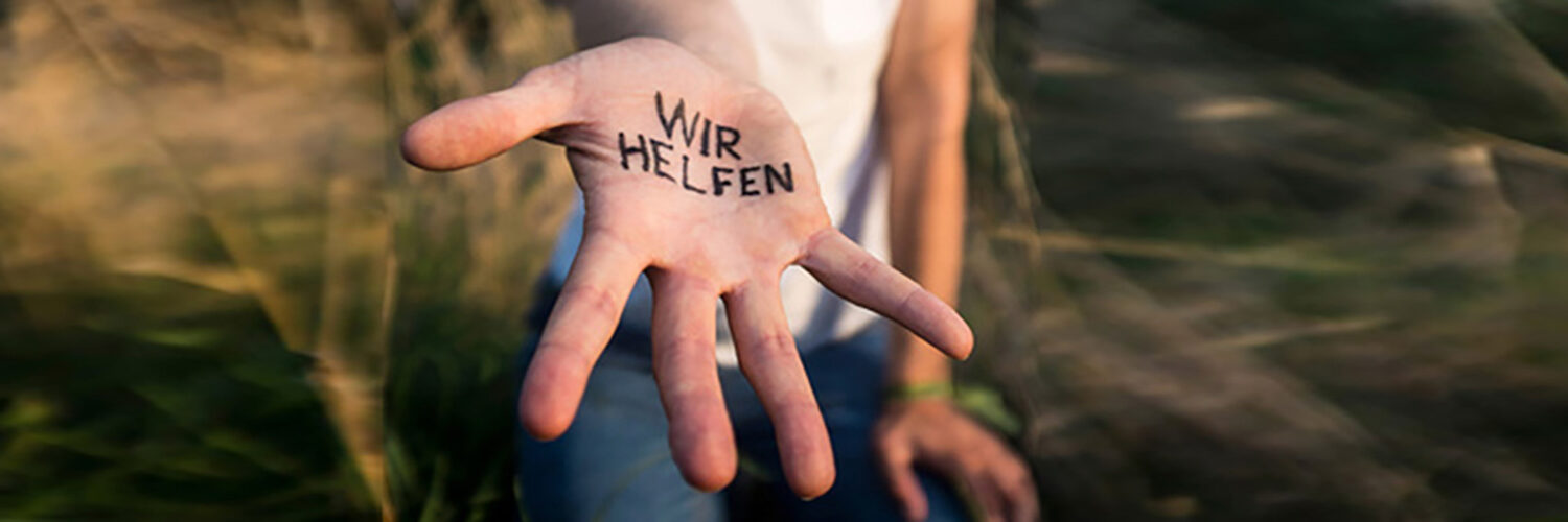 Eine ausgestreckte Hand mit dem Text